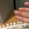 Pendientes Mini Estrella Super Brillantes para Mujer Nuevos Otoño/Invierno de Presión Lujo Ligero Nicho Gama Alta Versátiles Clips para Orejas Joyería para Orejas
