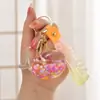 Llavero con Arena Líquida en Botella de Aceite, Botella que Brilla en la Oscuridad, Llavero de Ballena, Colgante Exquisito para Bolso, Lindo Accesorio para Llavero