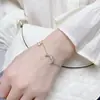 Electrochapado en oro real circón microincrustado temperamento joyería de mano diseño de nicho pulsera de estrella pulsera de moda personalidad al por mayor
