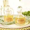 50ml botella de vidrio vacía regalo a mano estilo ins de moda 100g botella de miel botella de regalo de retorno de miel tapón de bola de vidrio para boda