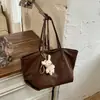 Bolsa tote de cor sólida nicho estilo coreano Shuai Mijia para mulheres, novo modelo 2026, bolsa de mão e bolsa de ombro de grande capacidade na moda para o trabalho