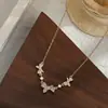 Cadena de clavícula elegante con microincrustaciones de circonita dorada auténtica para mujer, collar de mariposa de diseño único, gargantilla versátil minimalista