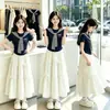 Conjunto de Verão 2026 Novo Elegante Xale Listrado Camiseta de Manga Curta Doce Saia de Princesa Conjunto de Duas Peças