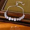 Pulsera extensible ovalada chapada en oro real con incrustaciones de circonita, sensación de lujo ligero de nicho de alta gama, accesorio de mano simple y elegante