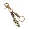 Llavero punk directo de fábrica para hombre, vintage de piel de vaca, aleación de bronce, colgante de palma, colgante para mochila de niña