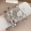 Pulsera de cadena retorcida geométrica transfronteriza europea y americana para mujer, moderna y elegante para ir al trabajo, lujo ligero y sensación de alta gama, joyería al por mayor