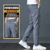 Pantalones casuales de seda de hielo directo de fábrica para hombre, estilo delgado de verano, versión coreana, corte ajustado, empalmado, a la moda, moderno, pantalones de pierna recta holgados