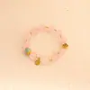 Pulsera bicolor de cristal azul natural y cristal rosa con diseño de oso y rosa, una pulsera blanca de lujo ligero y estilo antiguo fresco.
