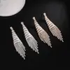 Llegada de fábrica nueva aretes largos de borla con incrustaciones de diamantes personalidad flash Diamante elegantes brillantes aretes al por mayor para mujer E789