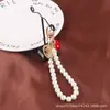 Nuevo Pulsera Creativa de Perlas, Llavero Colgante Lindo de Corazón de Melocotón de Aleación, Accesorio Metálico de Cabeza de Belleza, Bolso Decorativo para Mujer