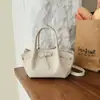 Bolso Transfronterizo Bolso Tote Pequeño para Mujer 2026 Estilo Nuevo Bolso Cubo Tejido Bolso de Hombro Cruzado de Gran Capacidad Simple