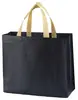 Bolsa no tejida en stock Impresión a color de película Bolso de mano para llevar ropa a domicilio Regalo publicitario Bolsa de compras promocional al por mayor