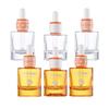 Botella de esencia líquida de patente con veta plateada de 30 ml, fondo grueso, doble anillo naranja blanco, botella de aceite esencial de 40 ml, botella cilíndrica con gotero