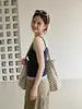 Sexy camisola de estilo americano de dos piezas falsas de alta gama impresionante para mujer, top ajustado sin mangas de verano para llevar solo o debajo