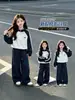 Conjunto Deportivo para Niña Otoño 2026 Nuevo Elegante Estilo Coreano para Niños Bloque de Color Sudadera con Capucha y Cuello Alto Pantalones de Pierna Ancha Conjunto de Dos Piezas