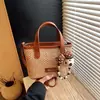 Bolso Tejido de Playa de Verano Transfronterizo para Mujer 2026 Nuevo Estilo de Verano Bolso Cubo Pequeño Súper Popular Bolso Cruzado