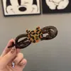 Clip de torsión para el pelo de gato con estampado de leopardo lindo y divertido sensación de nuca un clip de pinza de palabra fábrica de accesorios para el cabello para mujer un mayorista