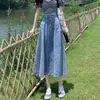 2026 Falda de Mezclilla Retro de Cintura Alta Moda de Longitud Media Cintura Elástica Cubre Cadera Adelgazante Fluida de Corte Amplio Venta al por Mayor