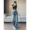 Jeans rasgados estilo retro americano talla grande para mujer, nuevo estilo principios de otoño 2026, diseño de calle moderno, pantalones de tiro bajo hasta el suelo