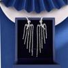 Nuevos pendientes largos de borla con microincrustaciones de circonita para mujer, transfronterizos europeos y americanos, wish, venta caliente, pendientes de lujo ligero al por mayor