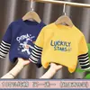 Ropa para niños para niños, camiseta de manga larga de retazos, imitación de dos piezas, camiseta base de algodón puro para niños mayores, nuevo estilo de top para primavera y otoño 2026