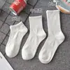 Meias de algodão Xinjiang 7A Antibacterianas e Resistentes a Odores para homens e mulheres, meias de algodão de cor sólida, comprimento médio, respiráveis, quentes, adequadas para esportes de outono e inverno