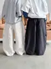 Pantalones para Niños 2026 Otoño Ropa Infantil Estilo Coreano Bolsillo Lateral Pantalones Casuales para Niños y Niñas Cómodos Versátiles Lavados Largos de Moda