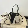 Bolso de mano estilo relajado, nueva colección otoño 2026, bolsa tote moderna y a la moda, popular para el trabajo y los desplazamientos, bolso cruzado tipo cubo para mujer