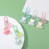 Colgante llavero de oso de resina color caramelo DIY accesorio de regalo cultural y creativo para bolsos, fundas de auriculares y decoraciones