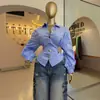 Ropa de mujer transfronteriza europea y americana 2026 otoño nuevo diseño elegante y juvenil camisa de manga larga a rayas con cuello camisero