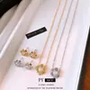 Resplandor Floral Aretes y collar de flor de circonita cúbica estilo francés, una cadena ligera y minimalista para la clavícula, perfectos para el uso diario y un estilo versátil