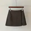 Saia outono nova assimétrica elegante com cinto lateral, cintura alta, afina a silhueta, saia evasê anti-exposição