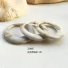 Mezcla de color crema exagerado retro geométrico redondo anillo hueco accesorios de resina diy aretes hechos a mano al por mayor