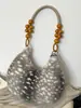 Bolso tipo dumpling esponjoso, simple y elegante, nuevo modelo otoño 2026, adecuado para el trabajo y los desplazamientos, bolso de hombro relajado y único