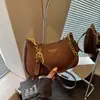 Bolso tipo bolsa de dumplings simple y casual transfronterizo para mujer, bolso de hombro de moda estilo coreano, nuevo bolso cruzado con cadena de verano 2026