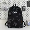 Elegante Mochila de Mariposa Rayada Verde Matcha Estilo Coreano Nicho Estudiantes de Secundaria Campus Fresca Versátil Mochila