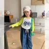 Fábrica de ropa infantil otoño nuevos lanzamientos camiseta interior infantil niños niñas medianas algodón puro cuello redondo 2026 niños pequeños dibujos animados coreano