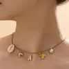 Collar con Colgante de Alfabeto Inglés de Nuevo Diseño Europeo y Americano Inicial A-Z Collar de Playa de Verano para Mujer