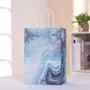 Bolsa de papel de mano al por mayor de fábrica, bolsa de papel Kraft, bolsa de regalo para fiestas, bolsa de dulces personalizada