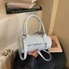 Bolsa pequena super quente para mulheres, novo estilo verão 2026, design de nicho, bolsa de ombro único transversal de bolinhas, bolsa cilíndrica redonda em alta no Instagram