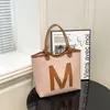 Bolso Tejido de Gran Capacidad para Mujer 2026 Nuevo Primavera Versátil Texturizado Bolso Tote de Gama Alta para la Escuela y el Trayecto