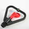 Venta al por mayor de fabricantes Aspersor de riego para jardín y césped de plástico rojo con forma de corazón de 4 puntos, rotación automática de 360 grados, mariposa