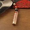 Llavero de tarro con mantra Lingyagn de aceite rojo, tarro hueco de latón puro con sutra, se puede abrir para guardar sutras, colgante de cuerda trenzada hecho a mano