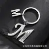 Llavero de estrella hueca con letra para comercio electrónico transfronterizo, llavero personalizado con letra nueva para hombre, accesorios