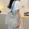 Bolso de mano grande de paja para mujer, nuevo bolso tejido para la playa de vacaciones en la costa primavera 2026, bolso de un solo hombro para debajo del brazo para mujer