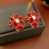 Pendientes de botón redondos con colgante en forma de corazón y lazo rojo, Agujas de plata Ankela, Pendientes de botón versátiles y de moda, Pendientes de alta gama de lujo ligero