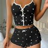 Pijama con estampado de corazón en contraste y tirantes divididos en la parte delantera de Amazon AliExpress.