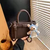 Bolsa de Mão e Bolsa Transversal Estilo Novo Primavera 2026 Transfronteiriça, Bolsa Saco Nicho Coreana para o Dia a Dia, Bolsa de Ombro Moda Retrô Feminina