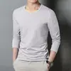 Camiseta base de color liso para hombre, camiseta de manga larga, ropa para hombre juvenil de color liso con cuello redondo, camiseta de manga larga versátil para otoño e invierno, ajuste ceñido para hombre