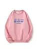 Sudadera de cuello redondo color albaricoque para mujer, nueva colección otoño/invierno, peso pesado, forrada de felpa, engrosada, con corte casual y holgado, y con un estampado floral azul de dibujos animados.